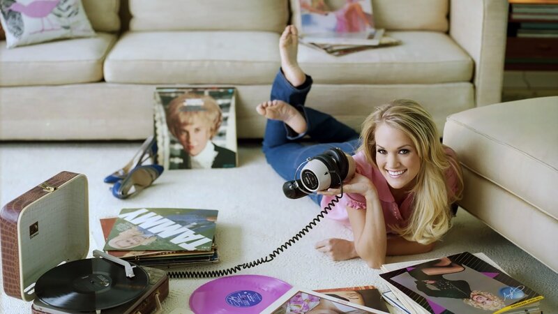 woman with headphones on floor