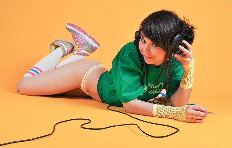 woman with headphones on floor