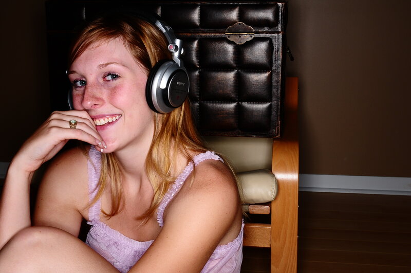 woman with headphones smiling