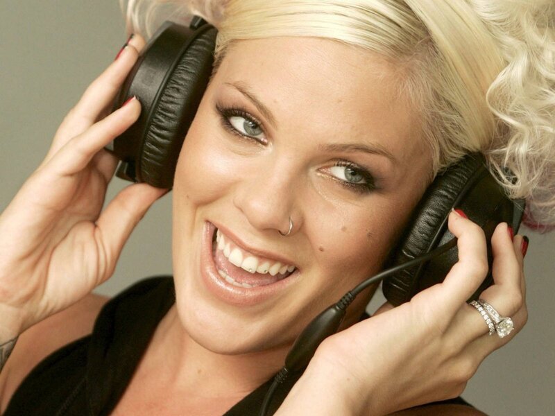 woman with headphones smiling