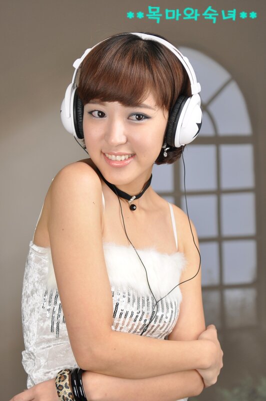 woman with headphones smiling