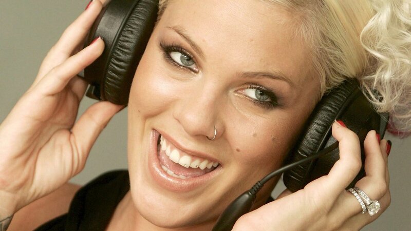 woman with headphones smiling