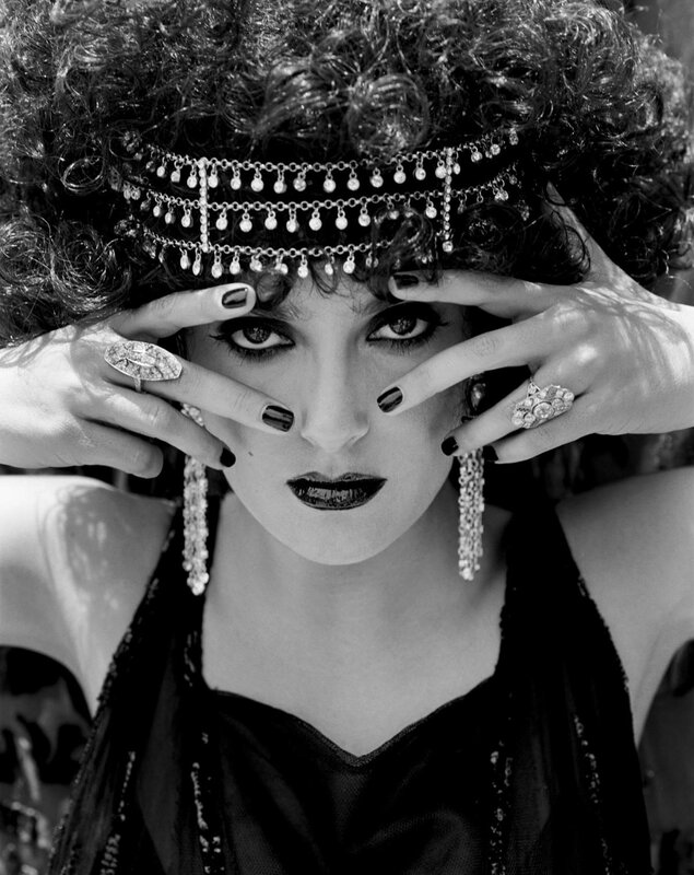 woman with headpiece and dark makeup