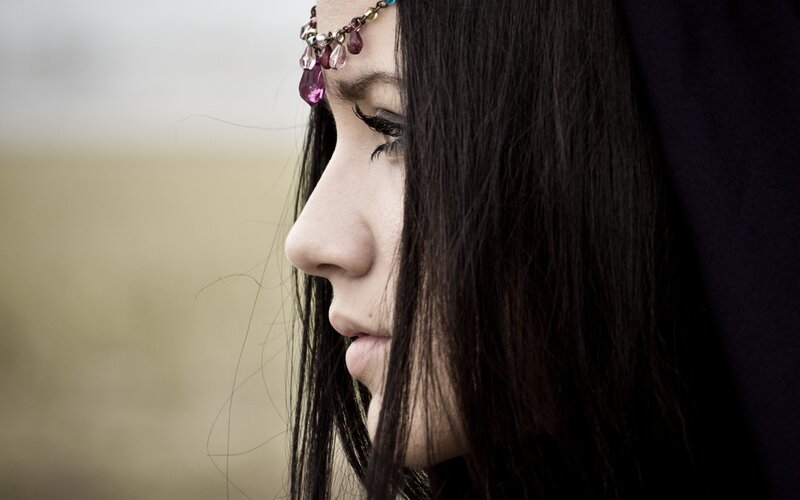 woman with headpiece in profile