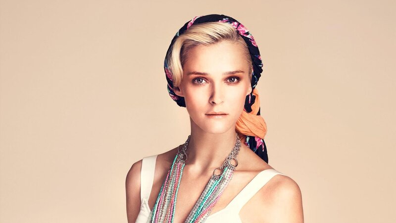 woman with headscarf and necklaces