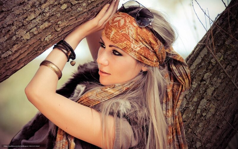 woman with headscarf by tree