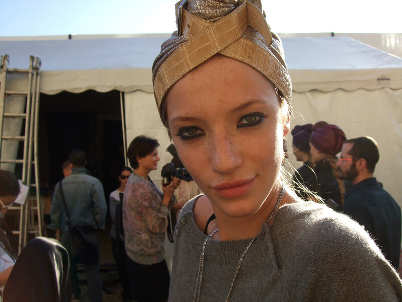 Woman with headwrap at outdoor event