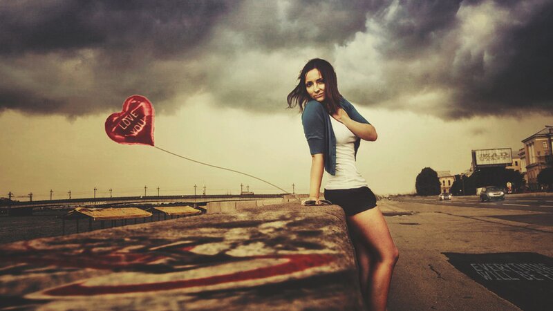 Woman with heart balloon