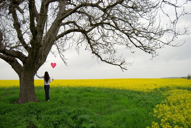 Woman with Heart Balloon — Yellow
