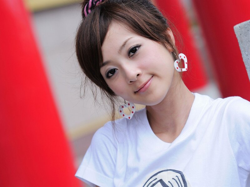 woman with heart earrings