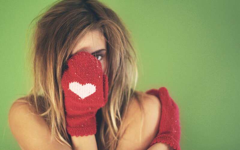 woman with heart mittens