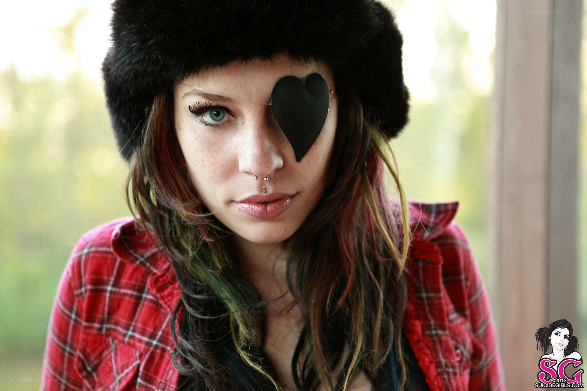 woman with heart-shaped eye patch