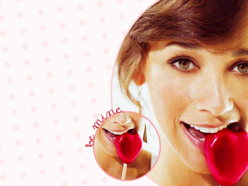 woman with heart-shaped lollipop