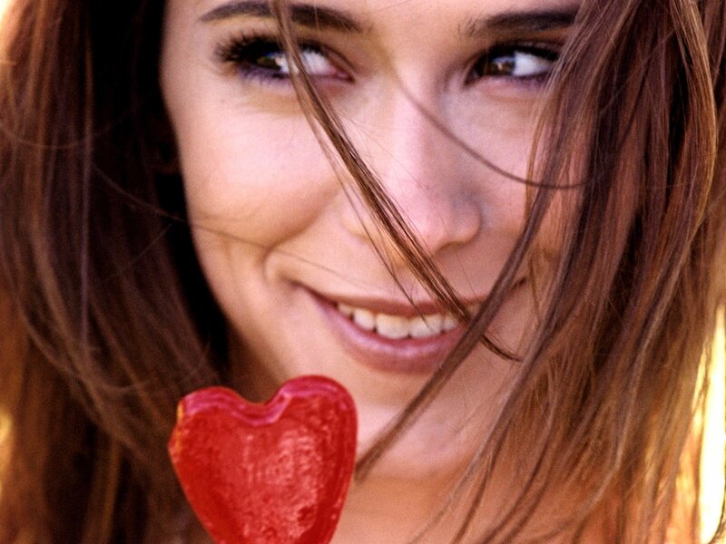 woman with heart-shaped lollipop