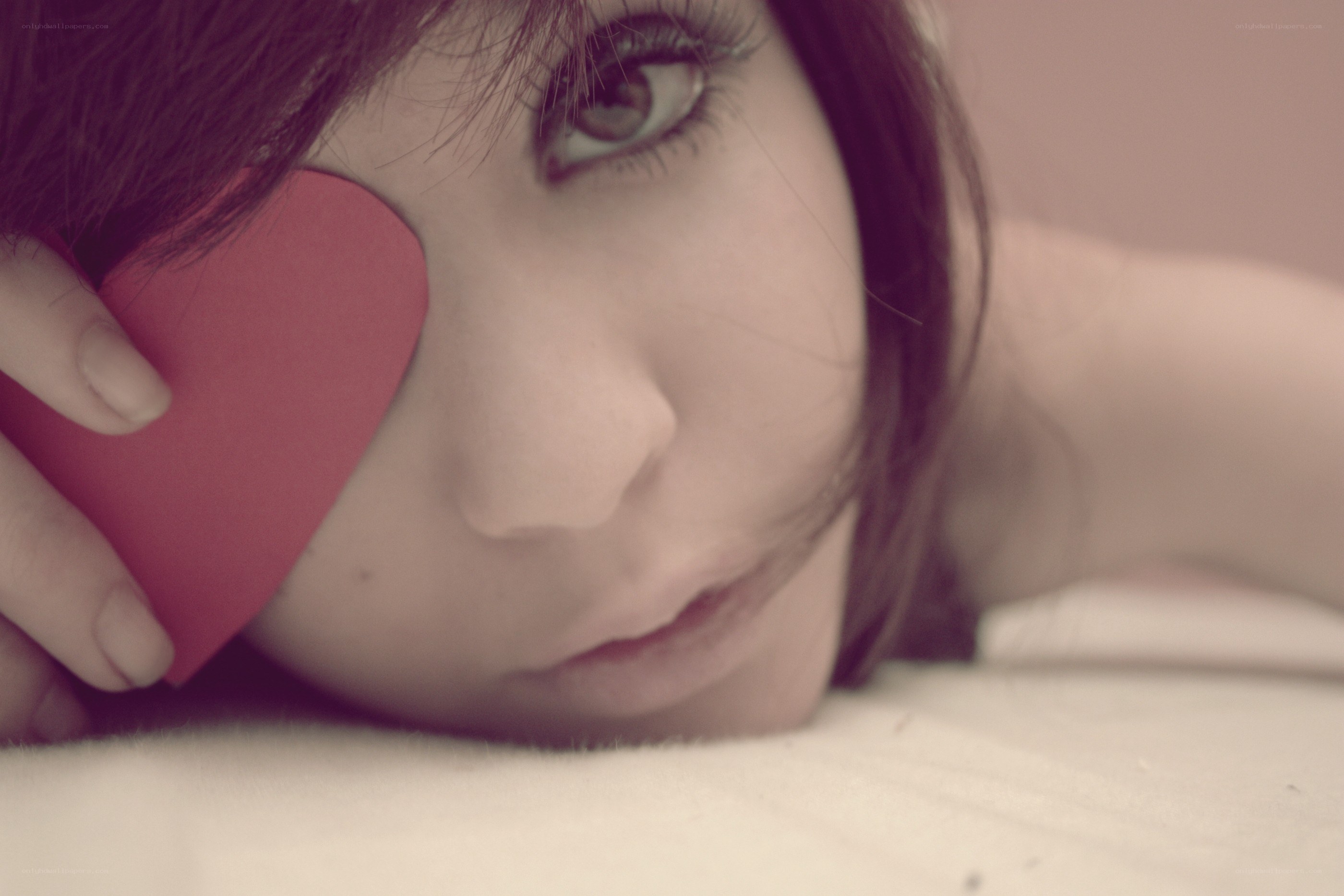 woman with heart-shaped object