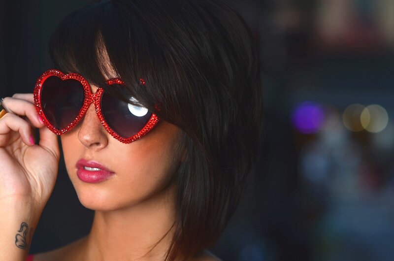 woman with heart-shaped sunglasses