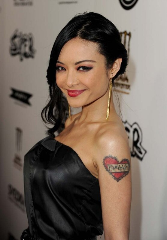 woman with heart tattoo at event