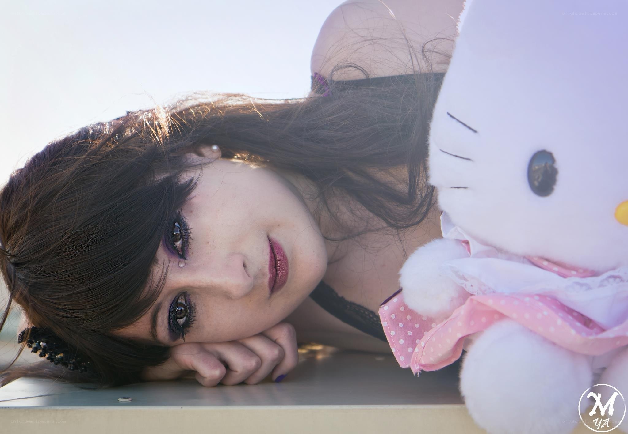 woman with hello kitty plush