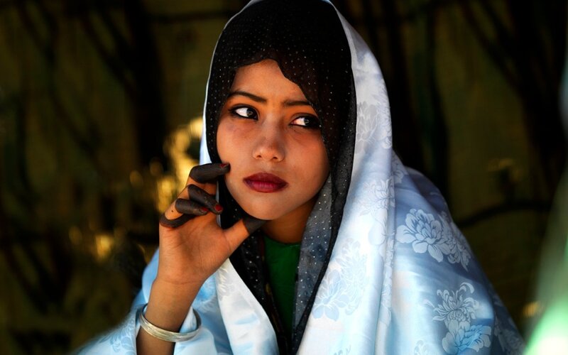 woman with henna-dyed hands