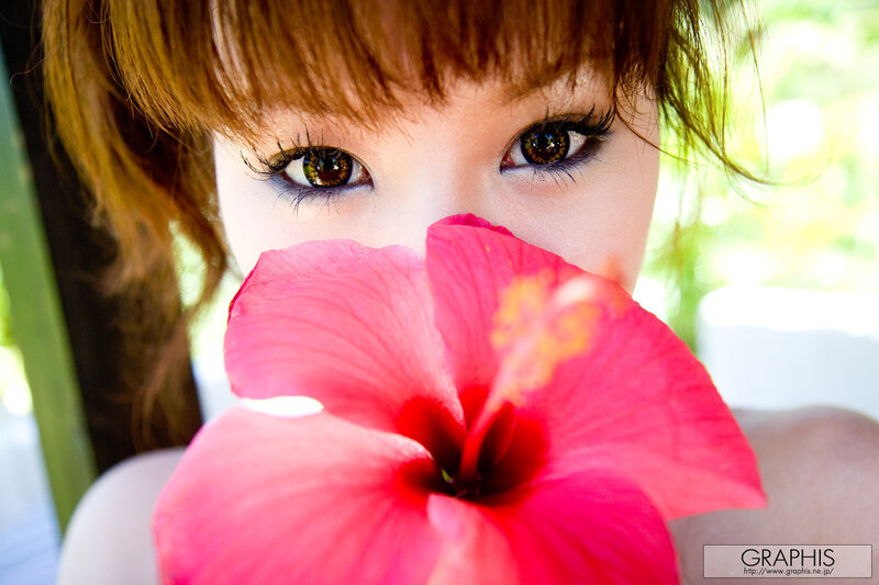 woman with hibiscus flower