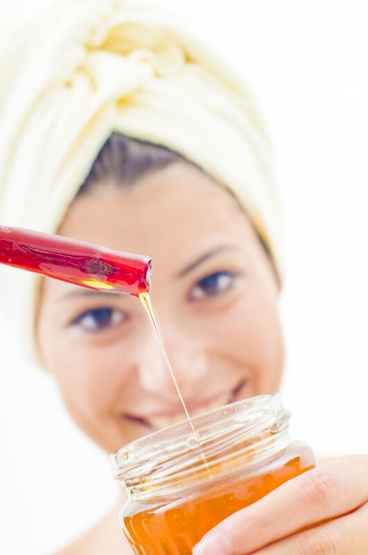 woman with honey jar
