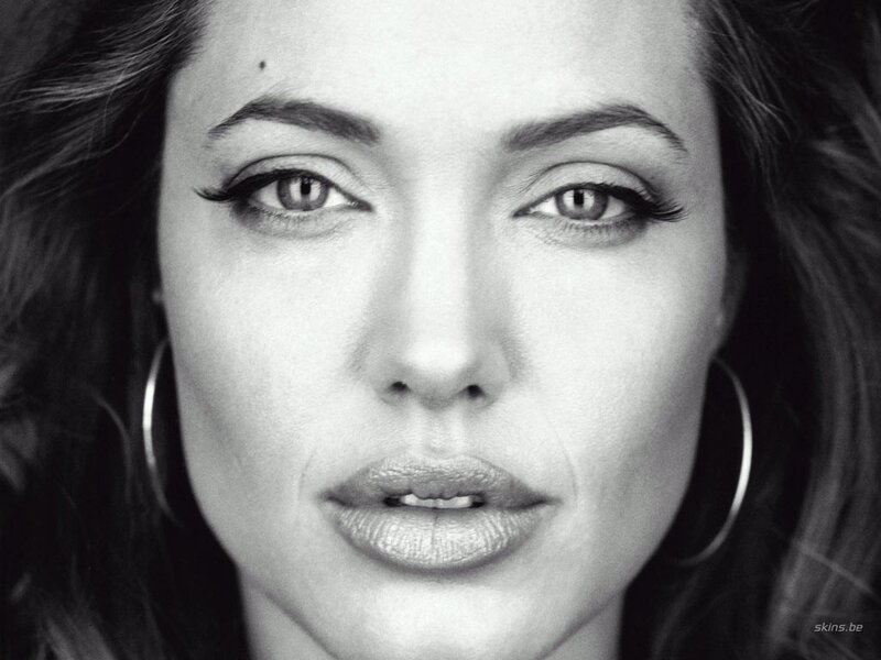Woman with Hoop Earrings — Black, Serious, Photograph
