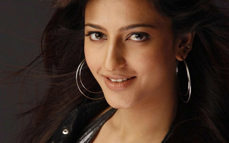 woman with hoop earrings smiling