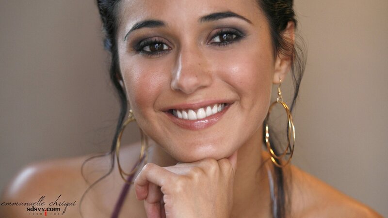 woman with hoop earrings smiling