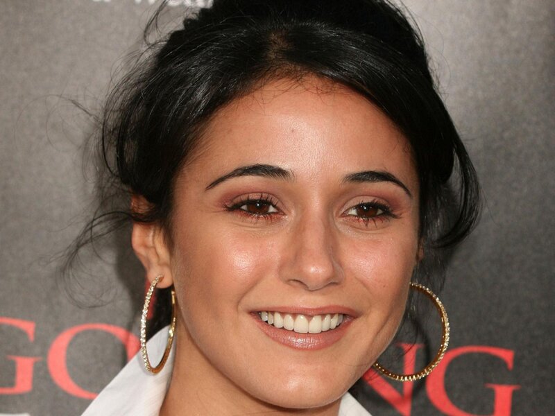 woman with hoop earrings smiling