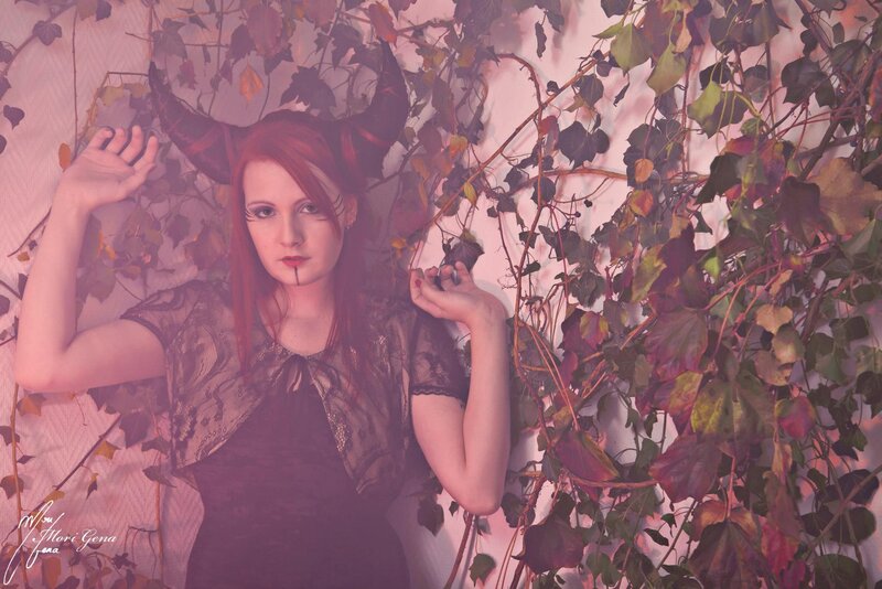 woman with horns and vines