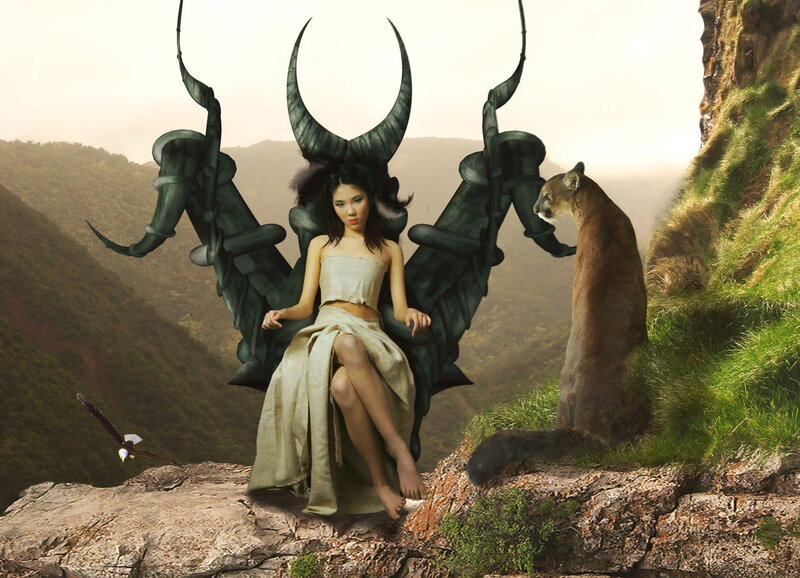 Woman with Horns on Cliff