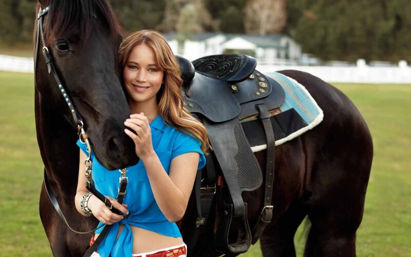 woman with horse in field
