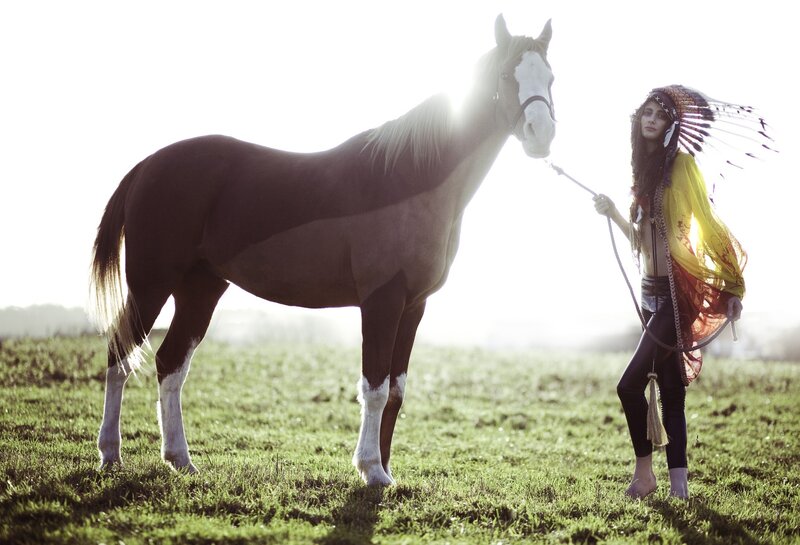 woman with horse in field