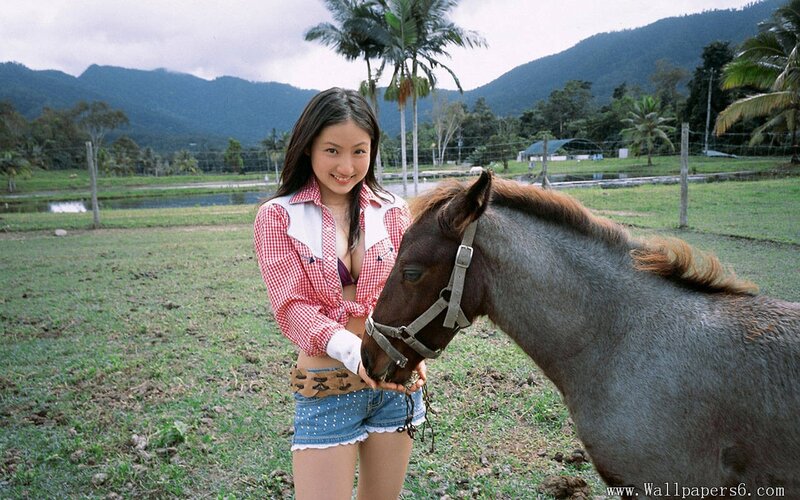 Woman with horse in field