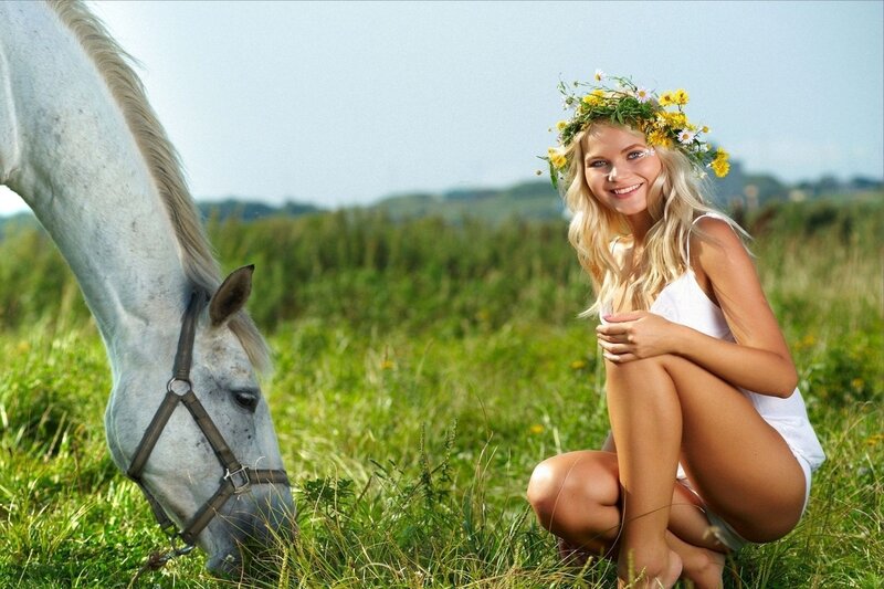 Woman with horse in field