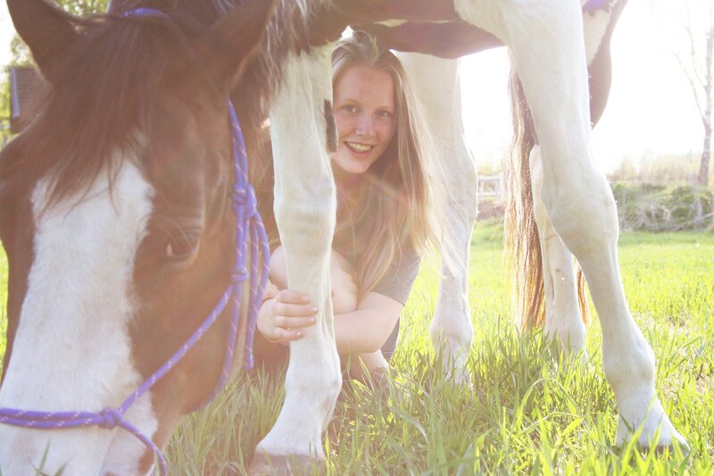 woman with horse in field