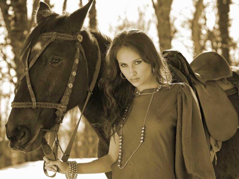 woman with horse in forest
