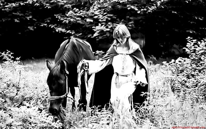 woman with horse in forest