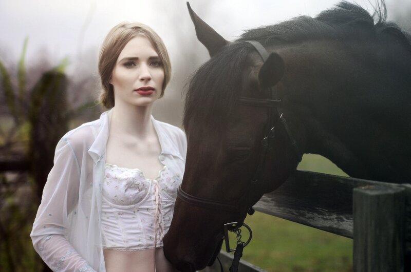 woman with horse in mist