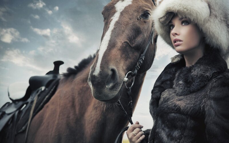 woman with horse in winter