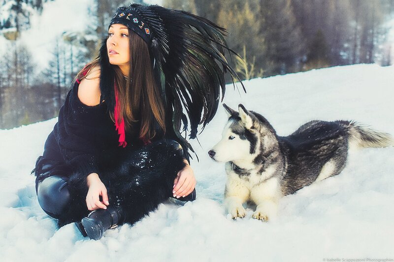 Woman with husky in snow