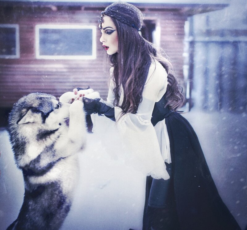 Woman with Husky in Snow — White, Dramatic