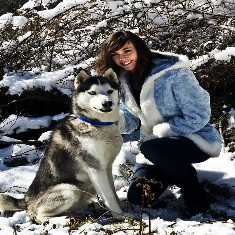 Woman with Husky in Snow — White