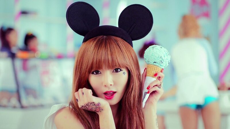 woman with ice cream and mouse ears