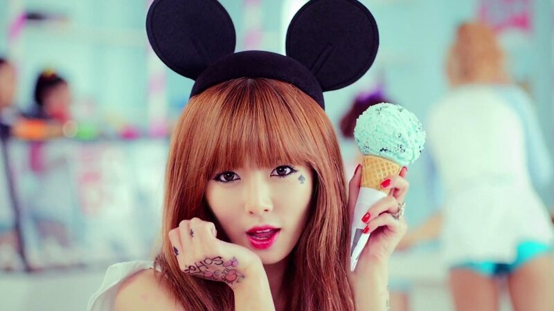 woman with ice cream and mouse ears