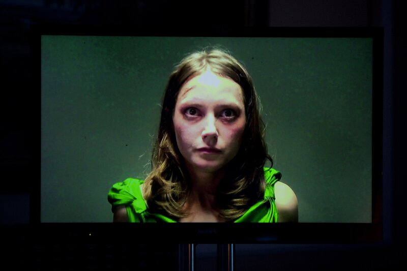 woman with injuries on screen