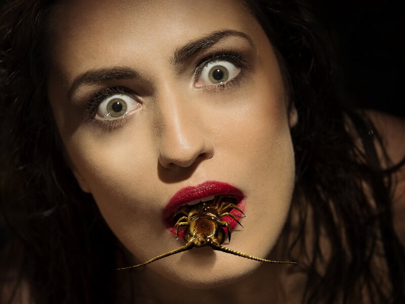 woman with insect in mouth