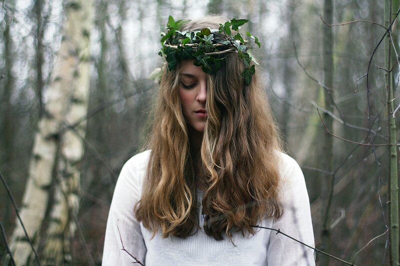 woman with ivy crown in forest