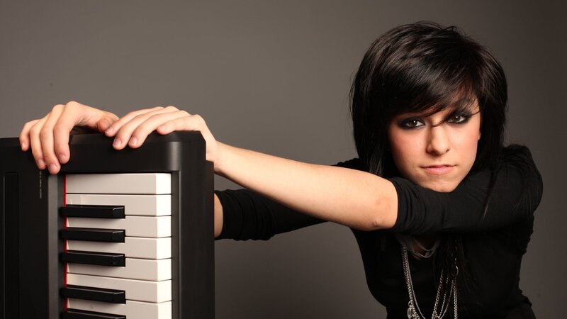 Woman with Keyboard — Black, Serious