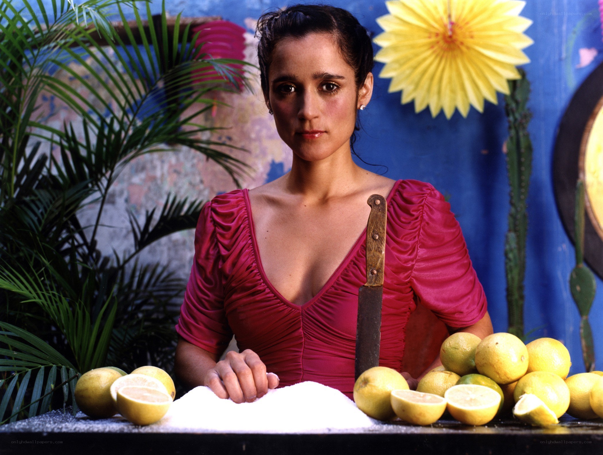 Woman with knife and lemons